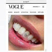 Tooth gems Vogue, gold isisngold teeth jewekry in Vogue first page