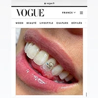 Tooth gems Vogue, gold isisngold teeth jewekry in Vogue first page