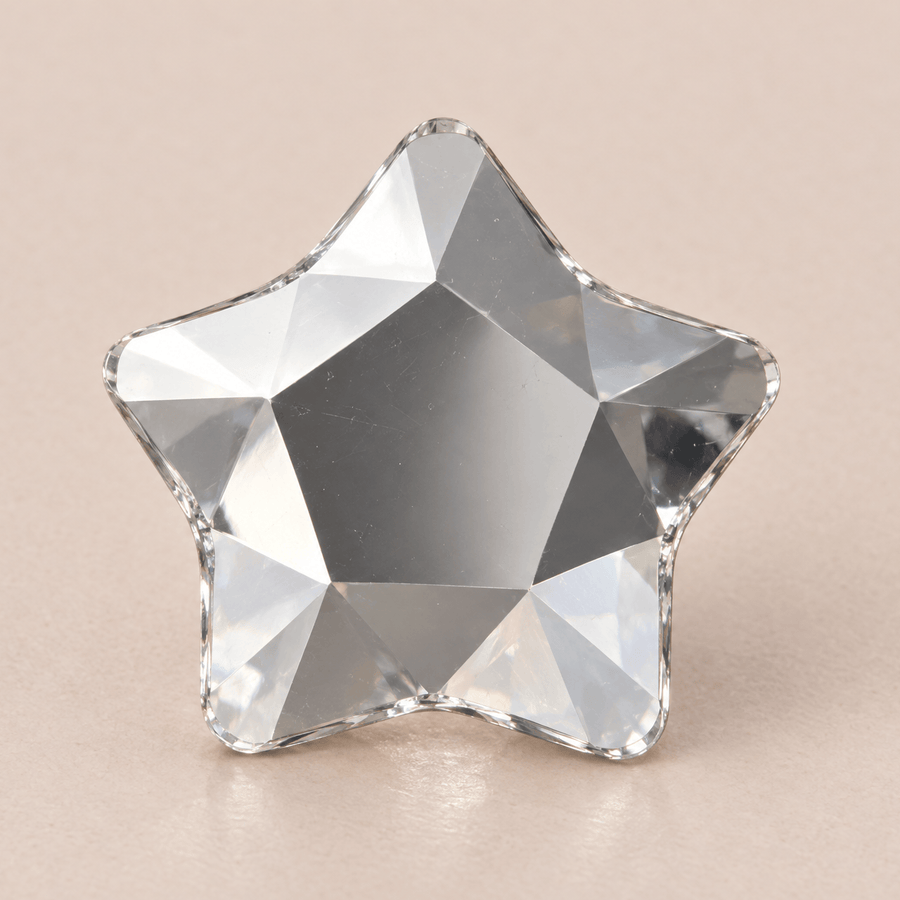 Swarovski Star Crystal Tooth gems — shown greatly enlarged