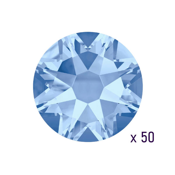 Swarovski 2058 Xilion Rose Light Sapphire dental tooth gem — close-up view