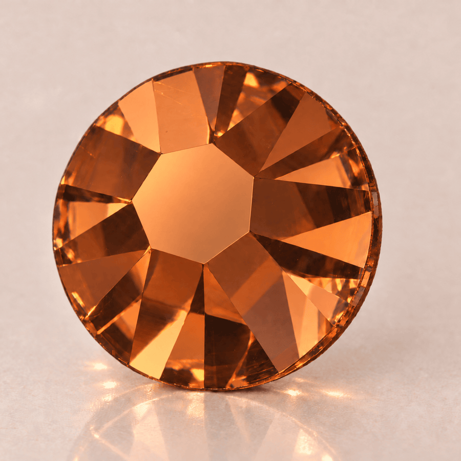 Swarovski Dark Orange Tooth gems — shown greatly enlarged
