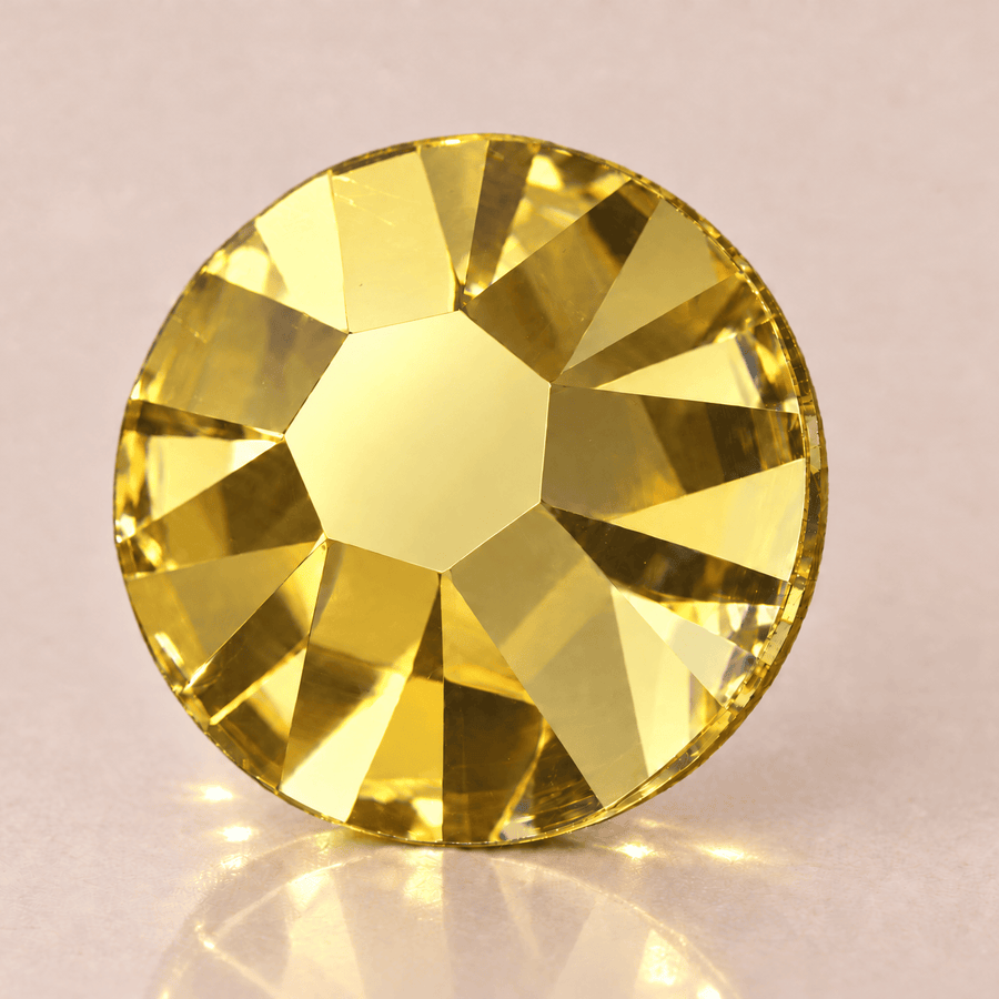 Swarovski Light Topaz Tooth Gems — sterk vergroot