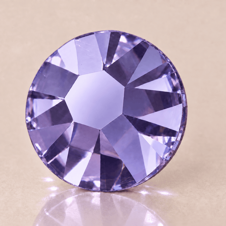Swarovski Tanzanite Tooth Gems — sterk vergroot