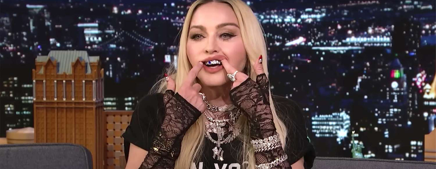 Tooth gems Madonna  wearing gold grillz